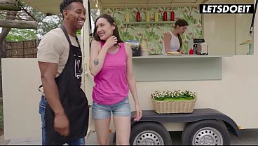 Tattooed Brunette Gets Oiled Up and Slides Down on Her Friend’s Big Black Cock at the Food Truck